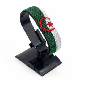 Handcrafted Algeria plain flag bracelet made with green, white, and red beads, adjustable beaded wrist accessory, displayed on a black stand.