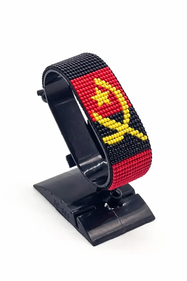 Handcrafted Angola flag bracelet Vertical Stripes made with red, black, and yellow beads, adjustable beaded wrist accessory, displayed on a black stand.