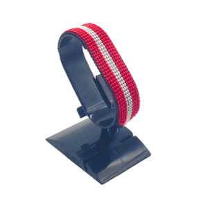 Handcrafted Austria flag bracelet made with red and white beads, featuring a adjustable beaded wrist accessory, displayed on a black stand.