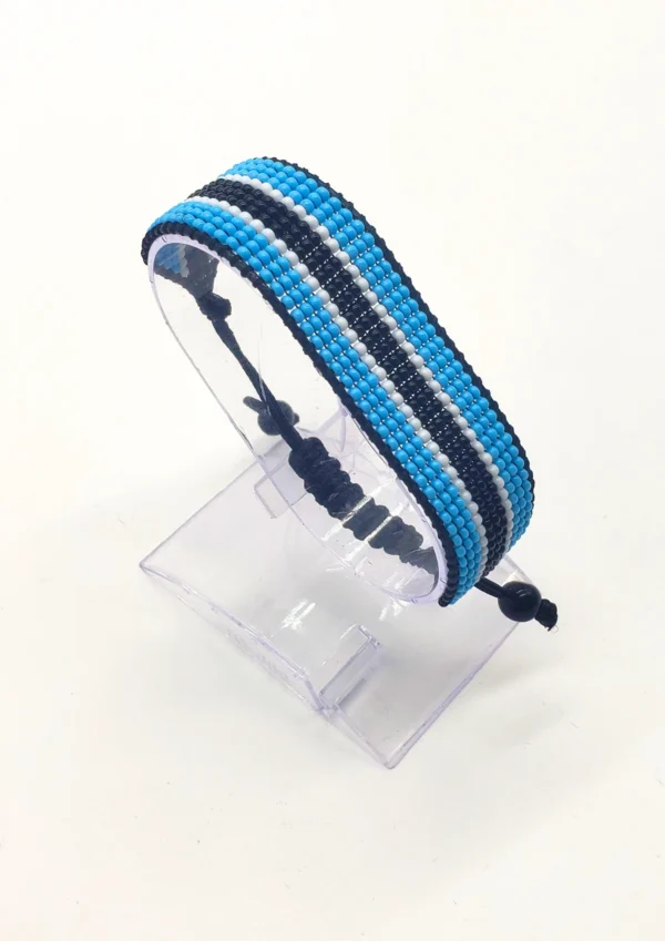 Bostwana flag bracelet handcrafted in authentic flag colors on Clear Stand.