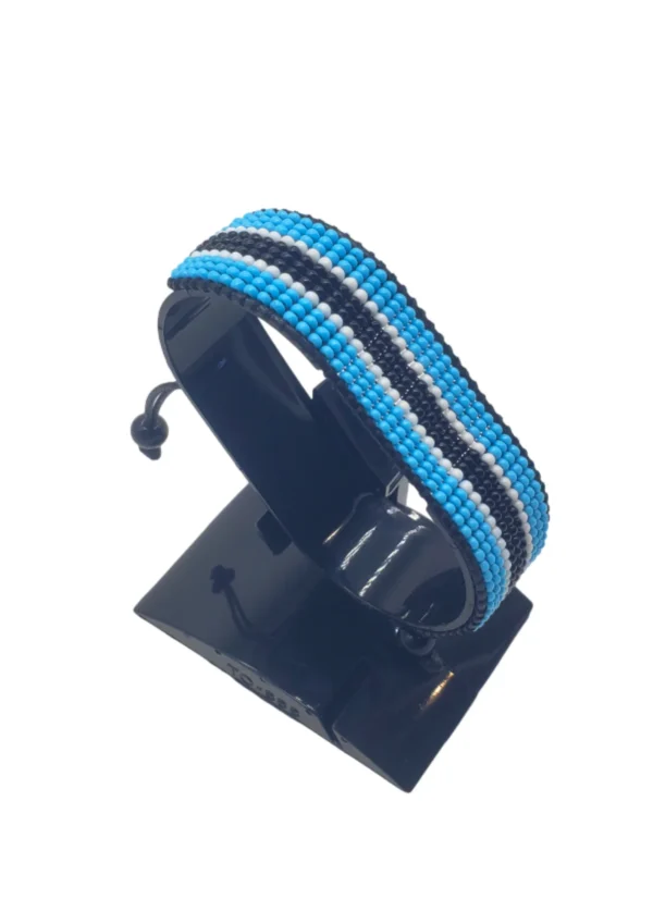 Bostwana flag bracelet handcrafted in authentic flag colors on Black Stand.