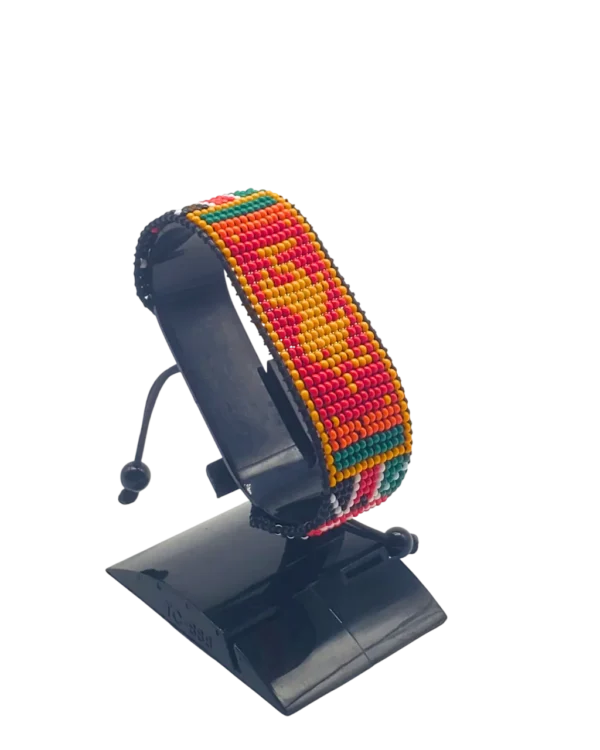 Kenyan Bhutan combo flag bead bracelet with adjustable fit displayed on a stand