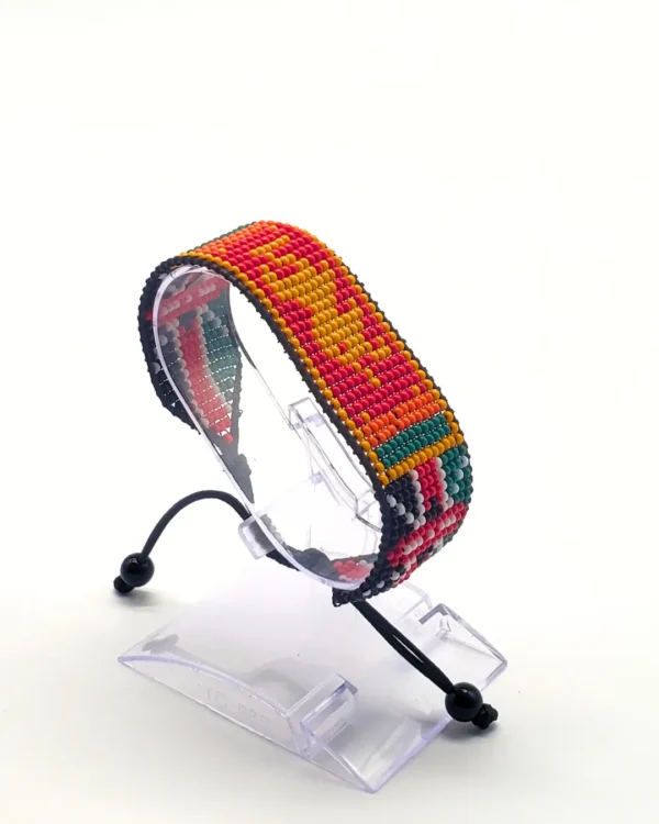 Kenyan Bhutan combo flag bead bracelet with adjustable fit displayed on a Clear stand