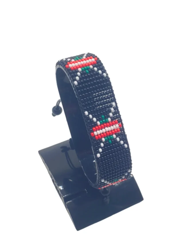 South Sudan flag bracelet handcrafted in authentic flag colors on Black Stand.