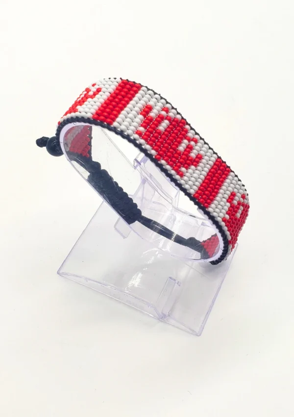Canada flag bracelet handcrafted in authentic flag colors on Black Stand.