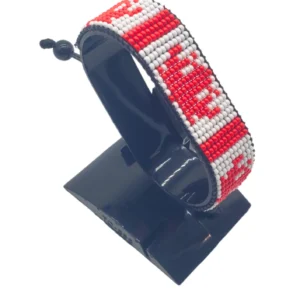 Canada flag bracelet handcrafted in authentic flag colors on Black Stand.