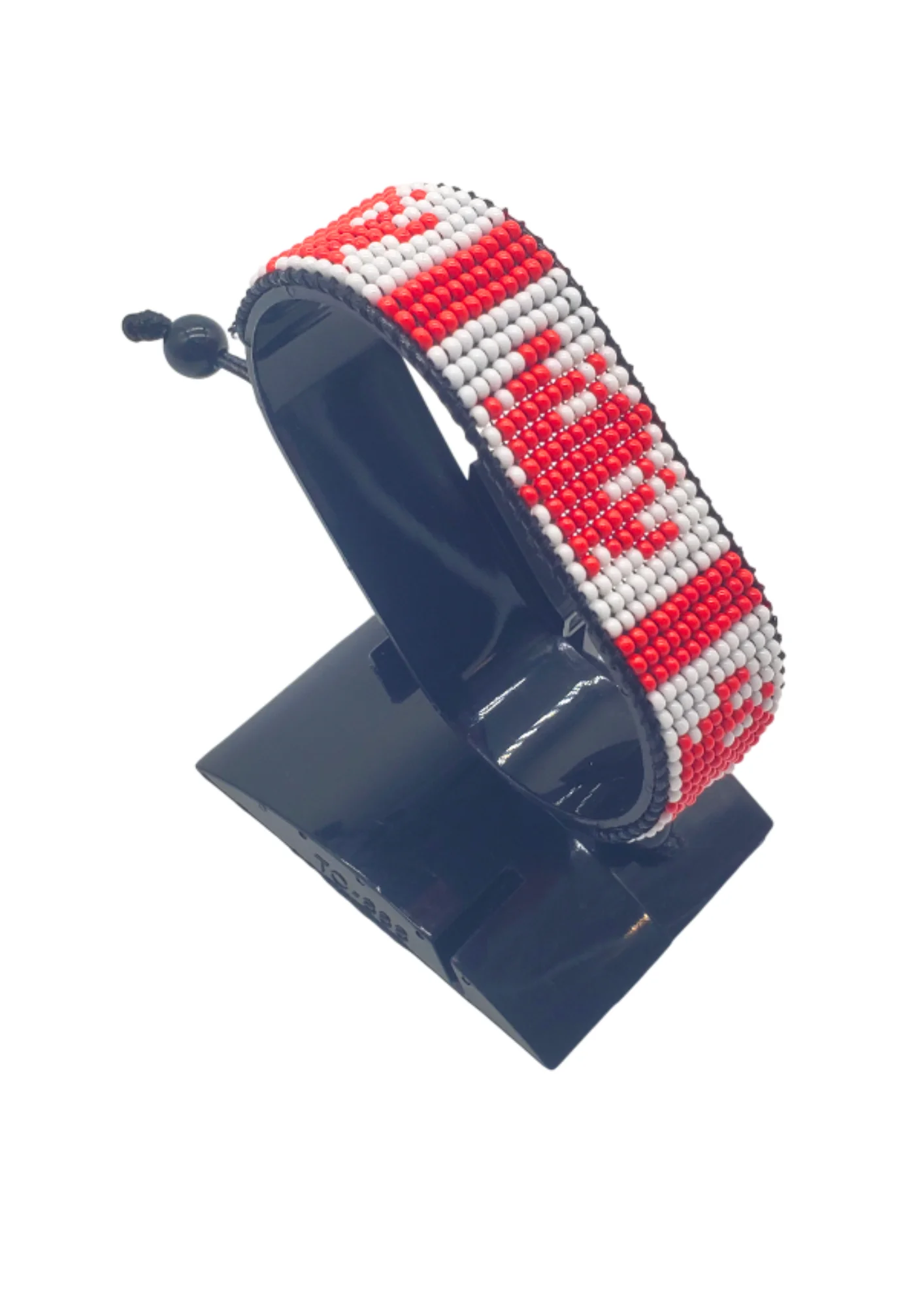 Canada flag bracelet handcrafted in authentic flag colors on Black Stand.