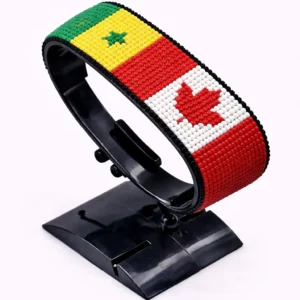 Canada Senegal Flag bracelet handcrafted in authentic flag colors on Black Stand.