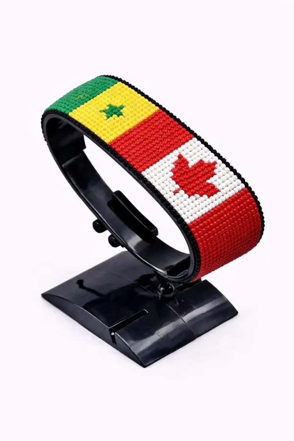 Canada Senegal Flag bracelet handcrafted in authentic flag colors on Black Stand.