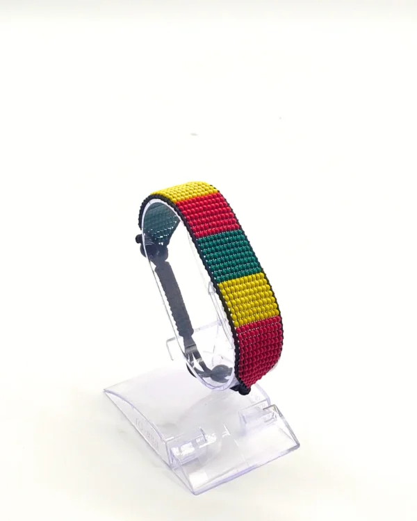 Cameroon flag bracelet handcrafted in authentic flag colors on Clear Stand.