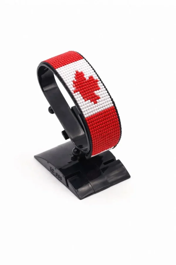 Canada flag bracelet handcrafted in authentic flag colors on Black Stand.
