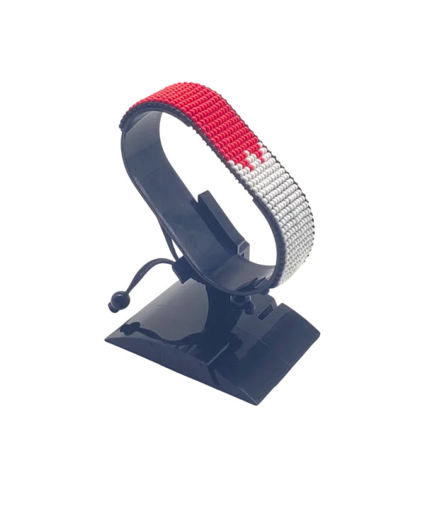 Canada flag bracelet handcrafted in authentic flag colors on Black Stand.