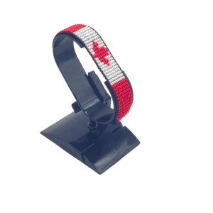 Canada flag bracelet handcrafted in authentic flag colors on Black Stand.