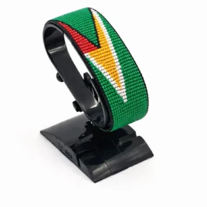 Handcrafted Guyana flag bracelet made with red and white beads, adjustable beaded wrist accessory, displayed on a black stand