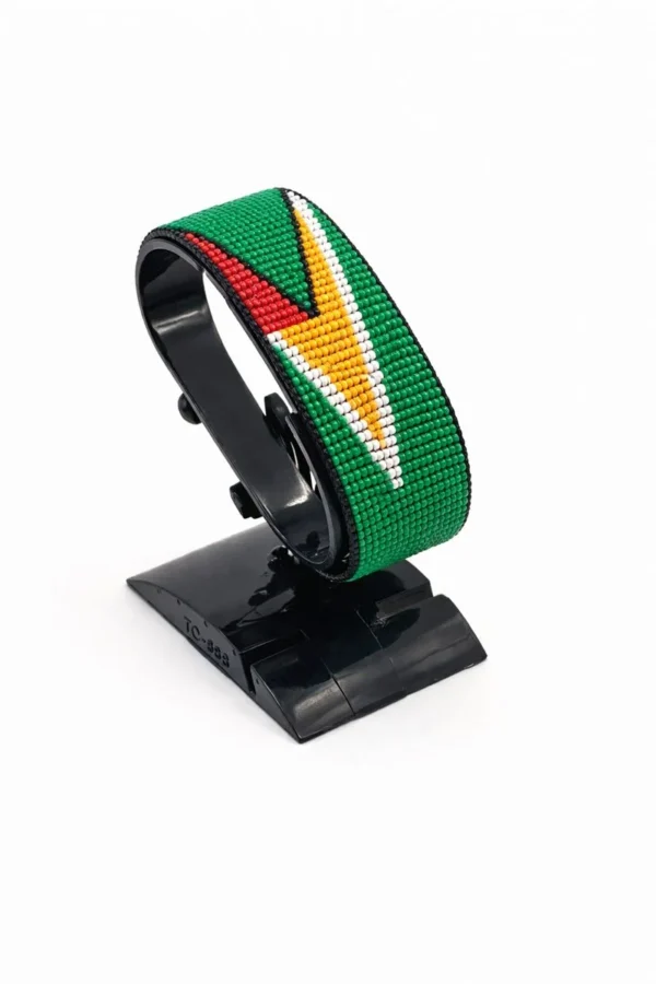 Handcrafted Guyana flag bracelet made with red and white beads, adjustable beaded wrist accessory, displayed on a black stand