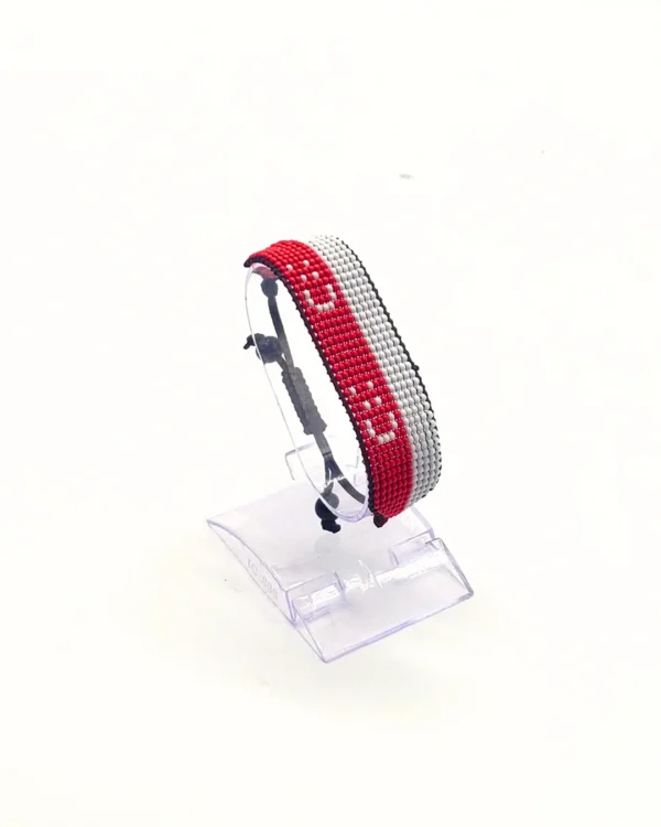 Indonesia flag bracelet handcrafted in authentic flag colors on Clear Stand.