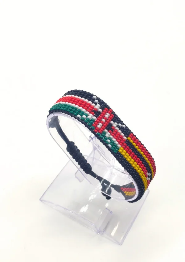 Handcrafted Kenya Uganda flag bracelet made with red and white beads, adjustable beaded wrist accessory, displayed on a Clear stand