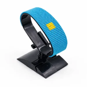 Handcrafted Kazakhstan flag bracelet made with red and white beads, adjustable beaded wrist accessory, displayed on a black stand