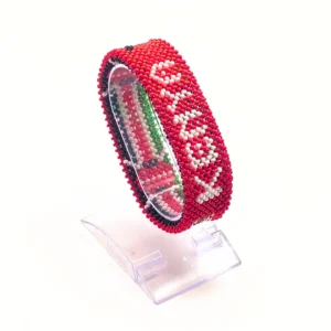 handcrafted Kenyan flag bead bracelet Double Layered on a Clear cuff display stand