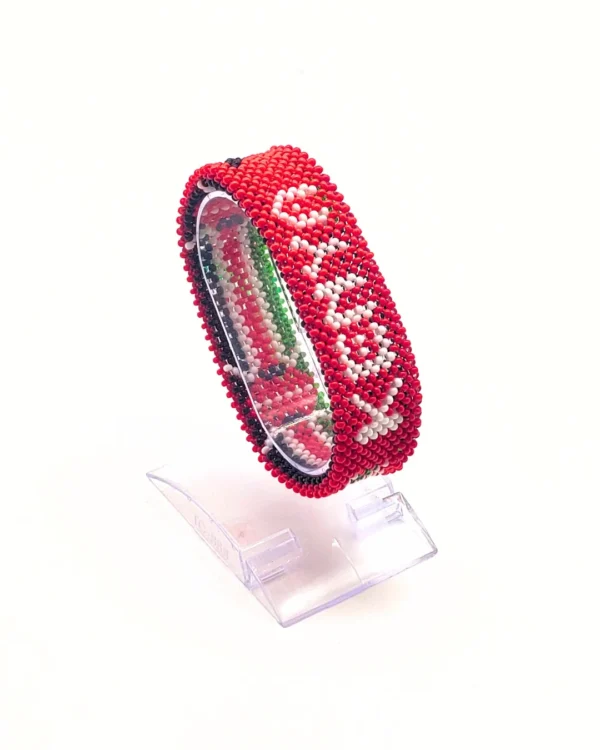 handcrafted Kenyan flag bead bracelet Double Layered on a Clear cuff display stand