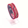 handcrafted Kenyan flag bead bracelet Double Layered on a Clear cuff display stand