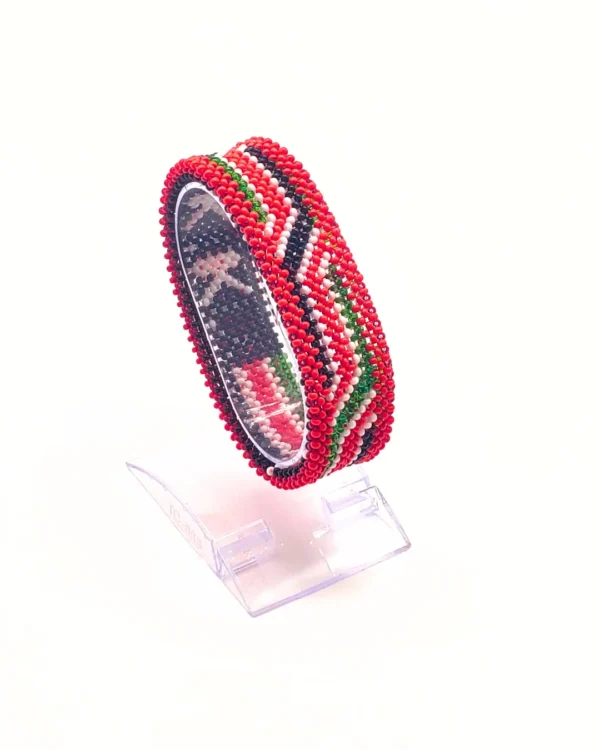 handcrafted Kenyan flag bead bracelet Double Layered on a Clear cuff display stand