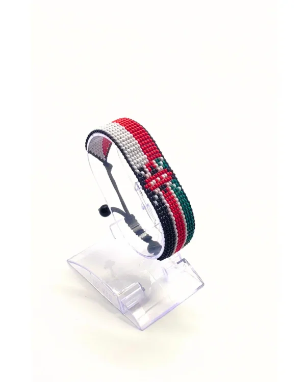 Handcrafted Kenya Austria flag bracelet made with red and white beads, adjustable beaded wrist accessory, displayed on a Clear stand