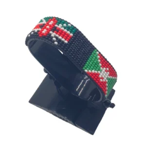 Handcrafted Kenya Burundi flag bracelet made with red and white beads, adjustable beaded wrist accessory, displayed on a black stand