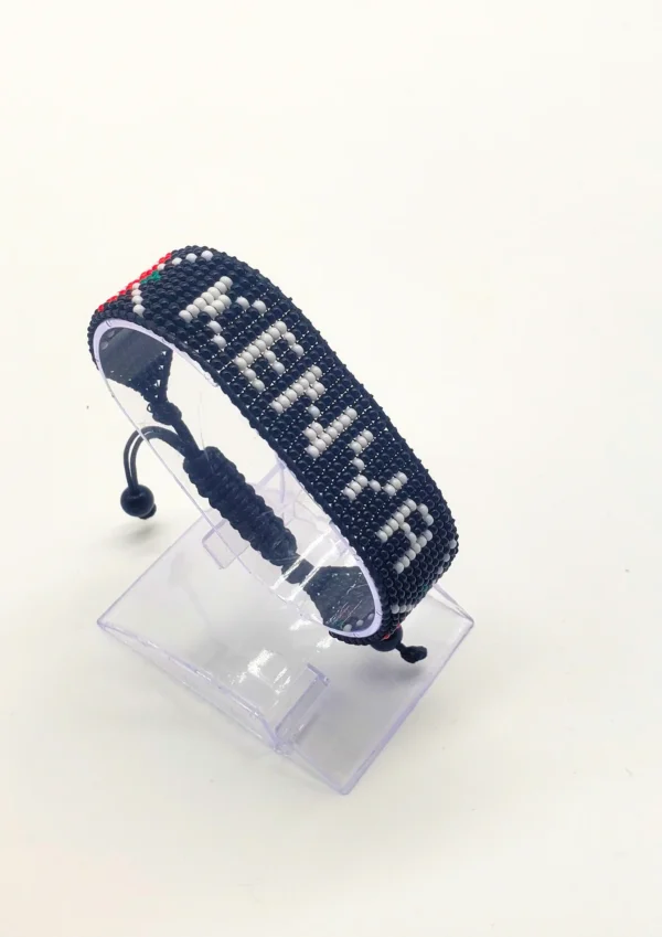 Kenya name flag bead bracelet with adjustable fit displayed on a Clear stand