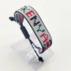 Kenya name flag bead bracelet with adjustable fit displayed on a Clear stand