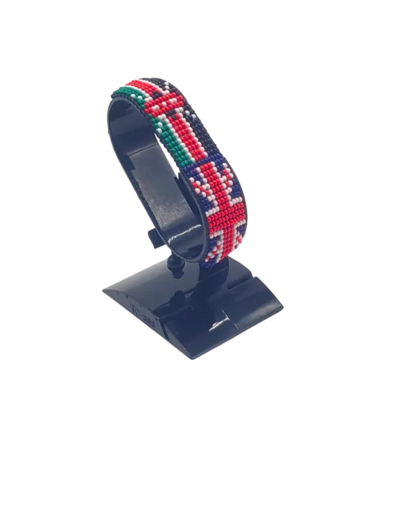 Kenyan UK combo flag bead bracelet with adjustable fit displayed on a stand