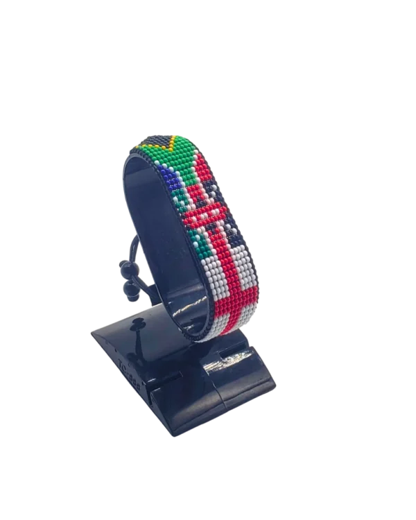 England Kenya South Africa flag bracelet handcrafted in authentic flag colors on Black Stand.