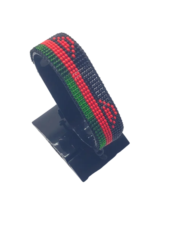 Malawi flag bracelet handcrafted in authentic flag colors on Black Stand.