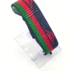 Malawi flag bracelet handcrafted in authentic flag colors on Black Stand.