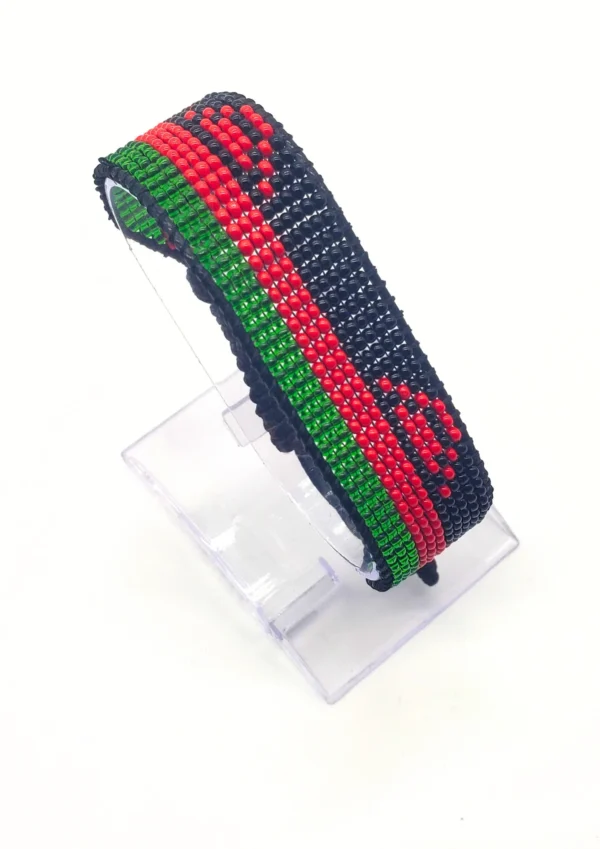Malawi flag bracelet handcrafted in authentic flag colors on Black Stand.