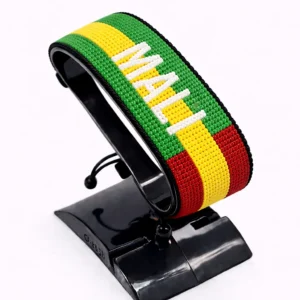 Handcrafted Mali flag bracelet made with red and white beads, adjustable beaded wrist accessory, displayed on a black stand