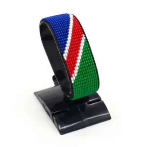Handcrafted Namibia flag bracelet made with red and white beads, adjustable beaded wrist accessory, displayed on a black stand
