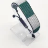 Nigeria flag bracelet handcrafted in authentic flag colors on Clear Stand.