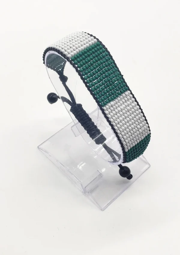Nigeria flag bracelet handcrafted in authentic flag colors on Clear Stand.