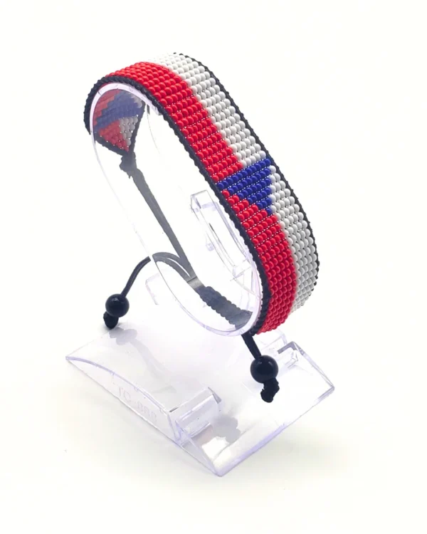 Norway flag bracelet handcrafted in authentic flag colors on Clear Stand.