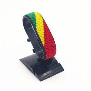 Handcrafted Republic Of Congo flag bracelet made with red and white beads, adjustable beaded wrist accessory, displayed on a black stand