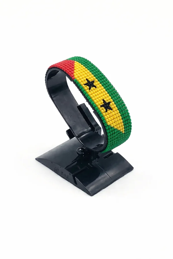 Handcrafted São Tomé and Príncipe flag bracelet made with red and white beads, adjustable beaded wrist accessory, displayed on a black stand