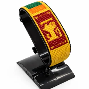 Handcrafted Sri Lanka flag bracelet made with red and white beads, adjustable beaded wrist accessory, displayed on a black stand