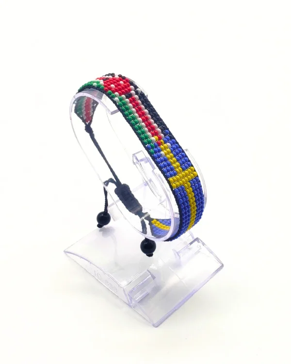 Sweden flag bracelet handcrafted in authentic flag colors on Clear Stand.