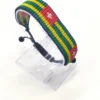 Handcrafted Togo flag bracelet with Name, adjustable beaded wrist accessory, displayed on a Clear stand.
