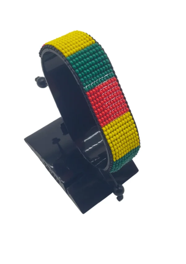 Handcrafted Togo flag bracelet with Name, adjustable beaded wrist accessory, displayed on a black stand.