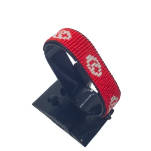 Handcrafted Tunisia flag bracelet, adjustable beaded wrist accessory, displayed on a black stand.