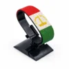Handcrafted Tajikistan flag bracelet, adjustable beaded wrist accessory, displayed on a black stand.