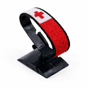 Handcrafted Tonga flag bracelet with Name, adjustable beaded wrist accessory, displayed on a black stand.