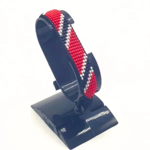 Handcrafted Trinidad & Tobago flag bracelet with Name, adjustable beaded wrist accessory, displayed on a black stand.